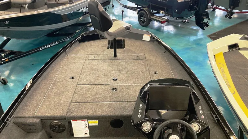 Slide: The Image of 2023 Crestliner XFC 189 fishing boat interior with steering console and seating. - 5