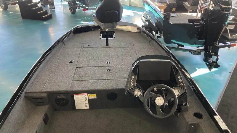 Slide: The Image of 2024 Crestliner XFC 189 boat interior with steering console and seating. - 6