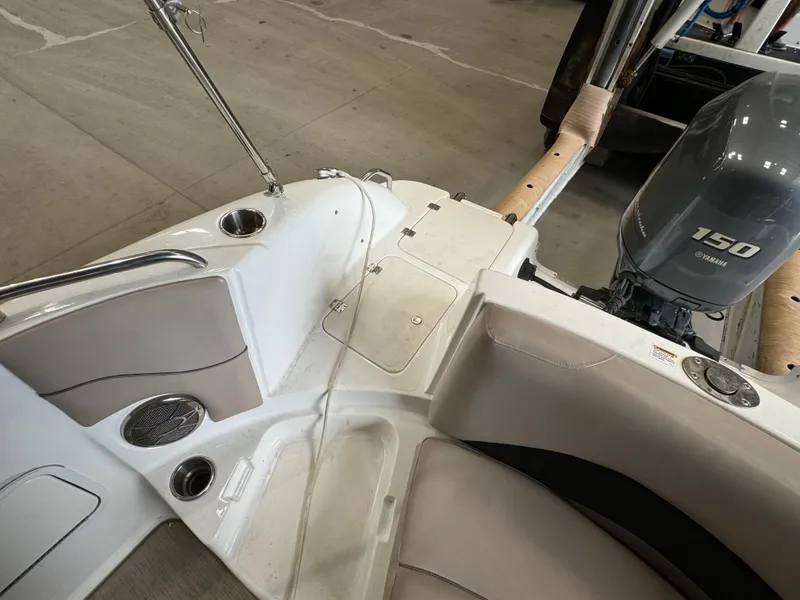 Slide: The Image of 2014 Hurricane SunDeck Sport 202 OB boat interior with Yamaha 150 engine. - 11