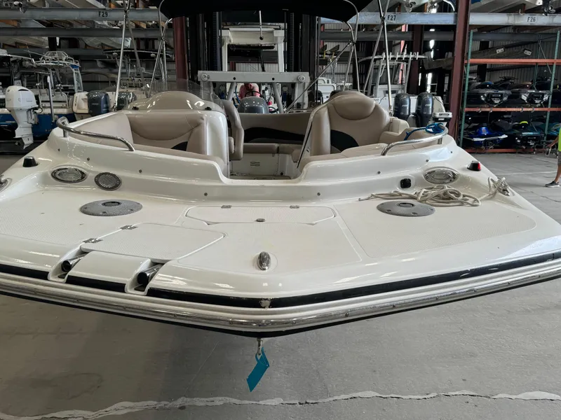Slide: The Image of 2014 Hurricane SunDeck Sport 202 OB boat in storage, front view. - 3