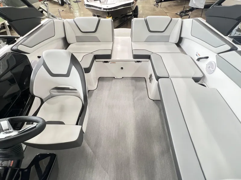 Slide: The Image of 2024 Yamaha Boats AR220 interior with modern seating and steering wheel. - 6