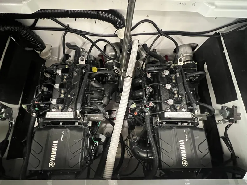 Slide: The Image of 2024 Yamaha Boats AR220 twin engines in engine compartment. - 7
