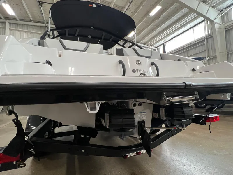 Slide: The Image of 2024 Yamaha Boats AR220 rear view in a showroom. - 8