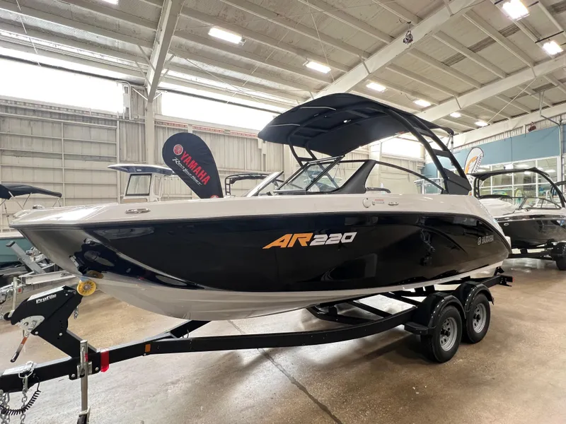 Slide: The Image of 2024 Yamaha Boats AR220 on trailer in indoor showroom. - 9