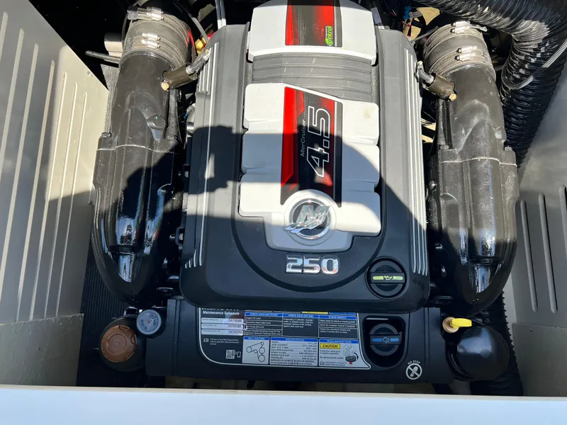 Slide: The Image of 2023 Sea Ray SPX 210 engine compartment with MerCruiser 4.5L 250 HP engine. - 10