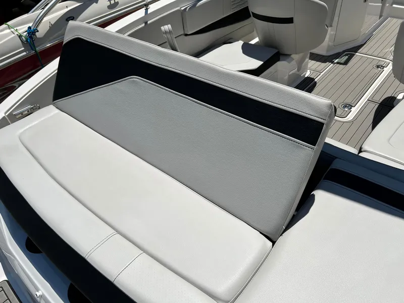 Slide: The Image of 2023 Sea Ray SPX 210 boat interior with sleek seating and modern design. - 11