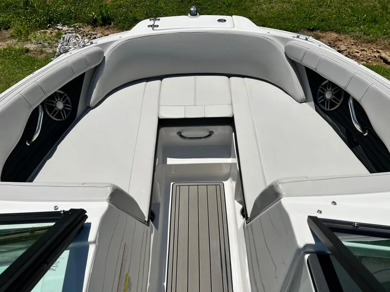 Slide: The Image of 2023 Sea Ray SPX 210 boat interior with white seating and speakers. - 5