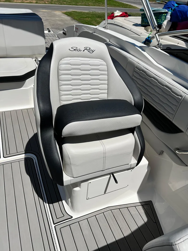 Slide: The Image of 2023 Sea Ray SPX 210 boat seat with black and white upholstery. - 8