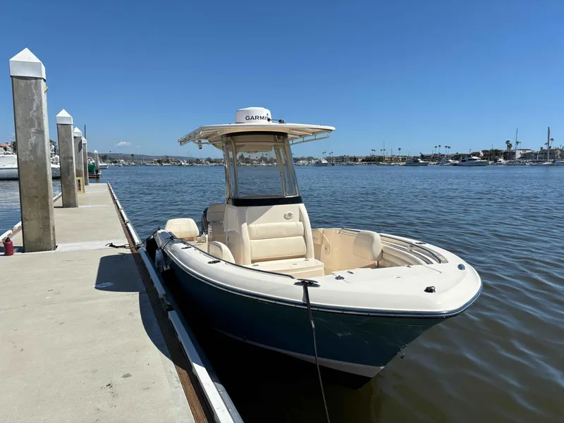 Slide: The Image of 2018 Grady-White Fisherman 216 boat docked by the marina on a sunny day. - 1