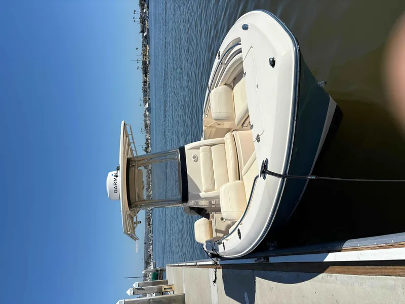 Slide: The Image of 2018 Grady-White Fisherman 216 boat docked on calm water. - 10