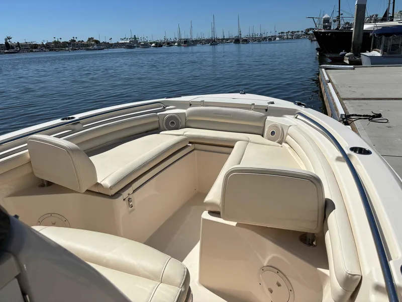 Slide: The Image of 2018 Grady-White Fisherman 216 boat with spacious seating, docked in a marina. - 9