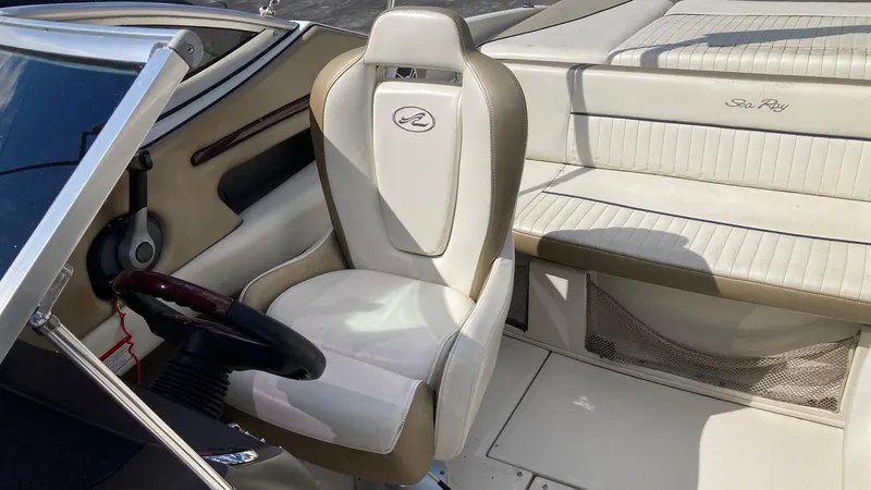 Slide: The Image of 2007 Sea Ray 210 Select boat interior with captain's chair and rear seating. - 4