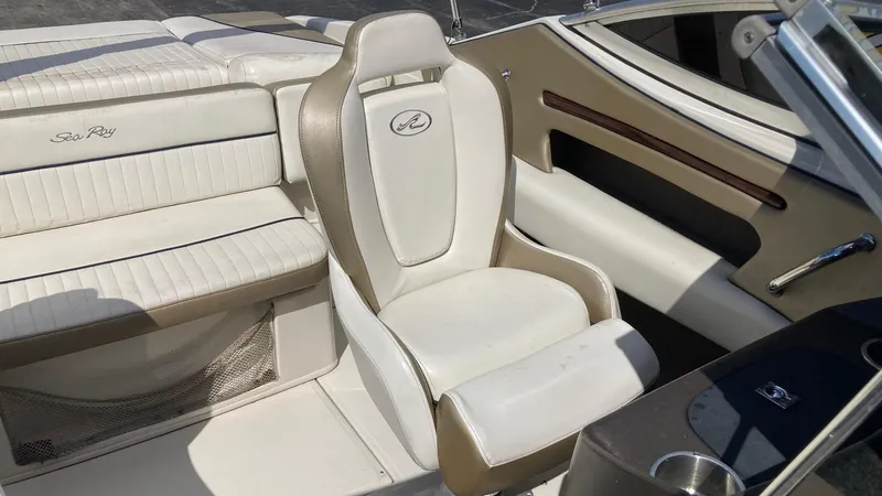 Slide: The Image of 2007 Sea Ray 210 Select boat interior with white and beige seating. - 5