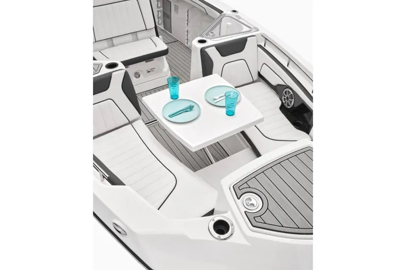 Slide: The Image of 2024 Yamaha Boats 255 FSH Sport E interior with seating and dining setup. - 6