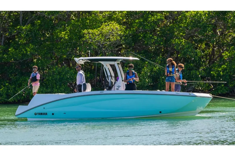 Slide: The Image of 2024 Yamaha Boats 255 FSH Sport E on water with people fishing. - 7