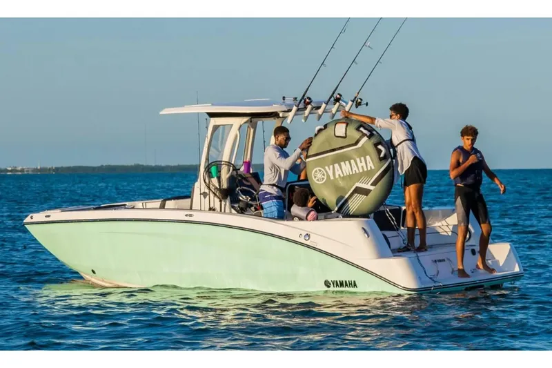 Slide: The Image of 2024 Yamaha Boats 255 FSH Sport E on water with people enjoying activities. - 8
