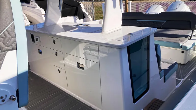 Slide: The Image of 2025 Regal 38 SAV boat interior with sleek cabinetry and seating area. - 12