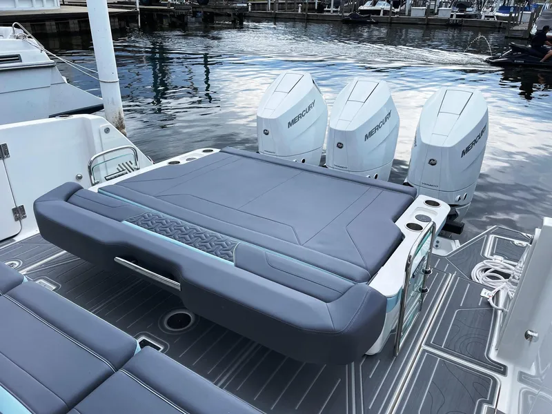 Slide: The Image of Regal 38 SAV 2025 boat with Mercury outboard engines at dock. - 18