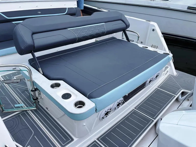 Slide: The Image of 2025 Regal 38 SAV boat with luxurious seating and cup holders. - 19