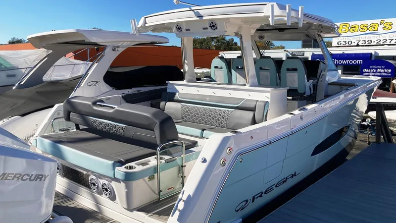 Slide: The Image of 2025 Regal 38 SAV luxury boat with spacious seating and modern design. - 5