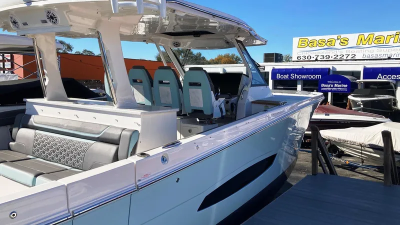 Slide: The Image of 2025 Regal 38 SAV boat at Basa's Marine showroom, featuring sleek design and modern seating. - 6