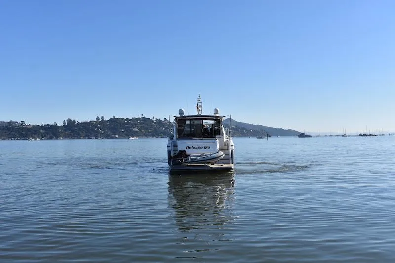 Slide: The Image of Princess V52 2013 yacht Release Me cruising on calm waters with scenic hills in the background. - 11