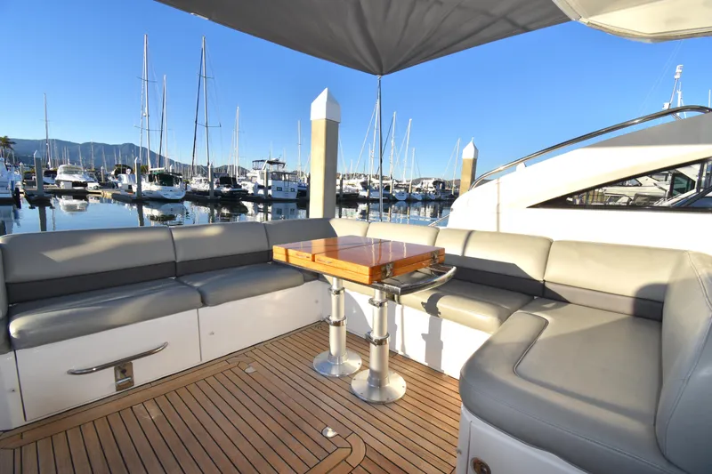 Slide: The Image of Luxury seating area on 2013 Princess V52 yacht at marina. - 14