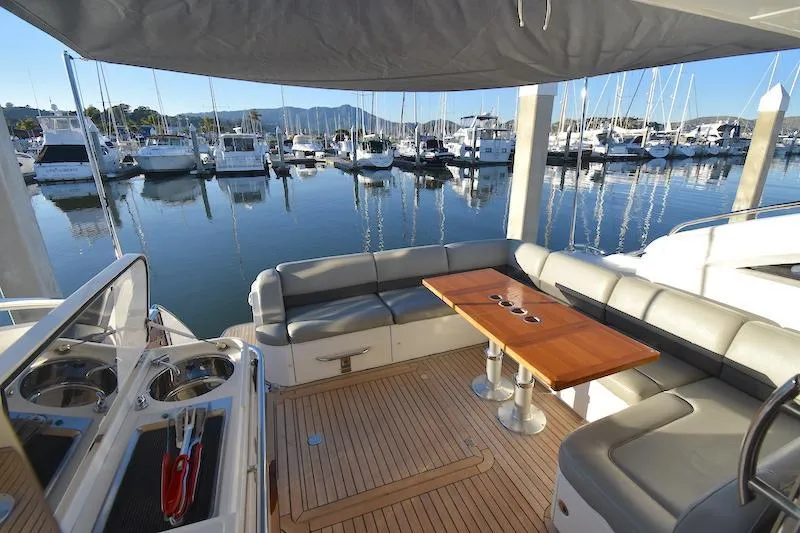 Slide: The Image of 2013 Princess V52 yacht with spacious deck and marina view. - 17