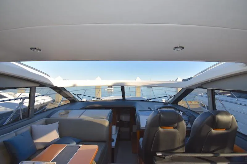 Slide: The Image of Interior view of 2013 Princess V52 yacht cockpit with panoramic windows. - 23
