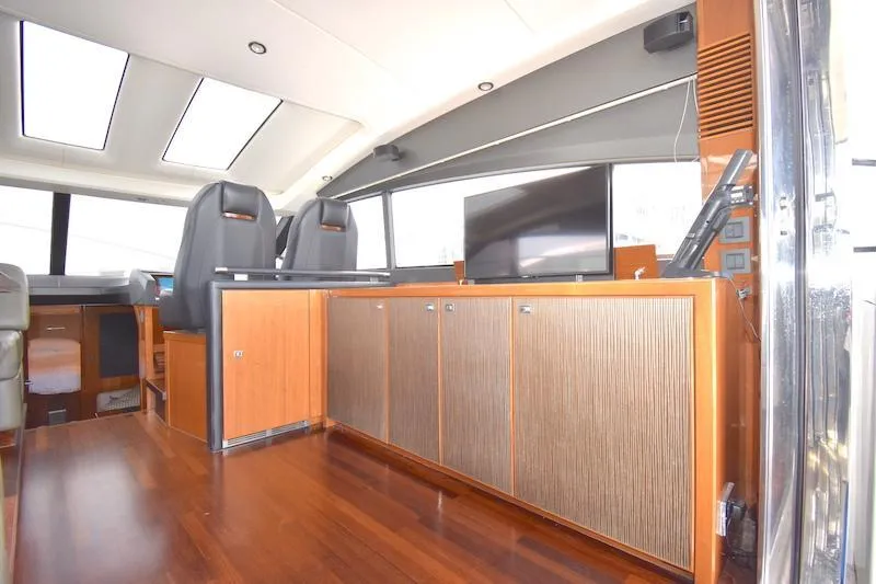 Slide: The Image of Interior of 2013 Princess V52 yacht with wooden flooring and modern cabinetry. - 24