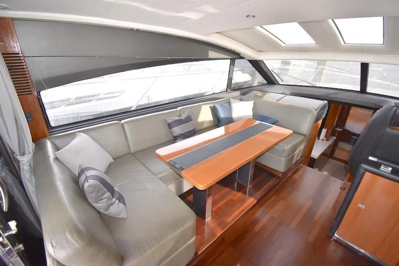 Slide: The Image of Luxurious interior of 2013 Princess V52 yacht with leather seating and wooden table. - 26