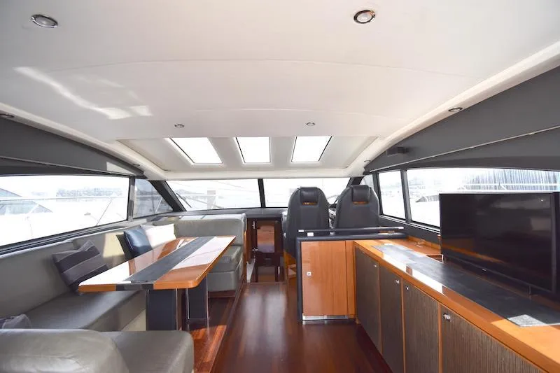 Slide: The Image of Luxurious interior of 2013 Princess V52 yacht with modern seating and large windows. - 27