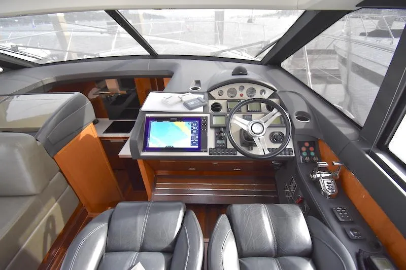Slide: The Image of Cockpit of 2013 Princess V52 yacht with navigation system and leather seats. - 28