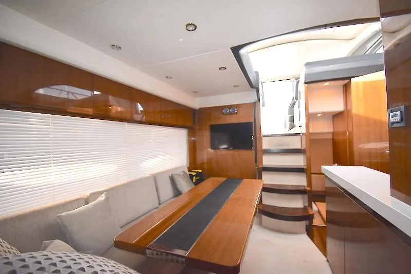 Slide: The Image of Interior of 2013 Princess V52 yacht with modern furnishings and wooden finishes. - 30