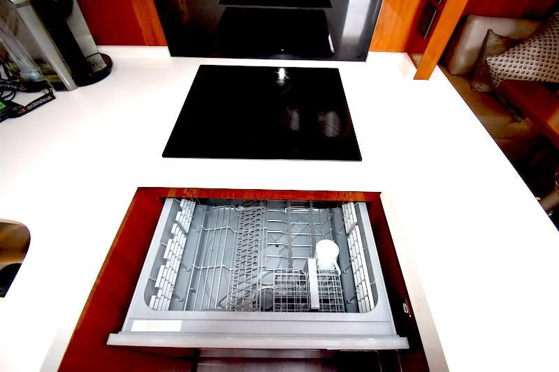 Slide: The Image of Open dishwasher in the kitchen of a 2013 Princess V52 yacht. - 34
