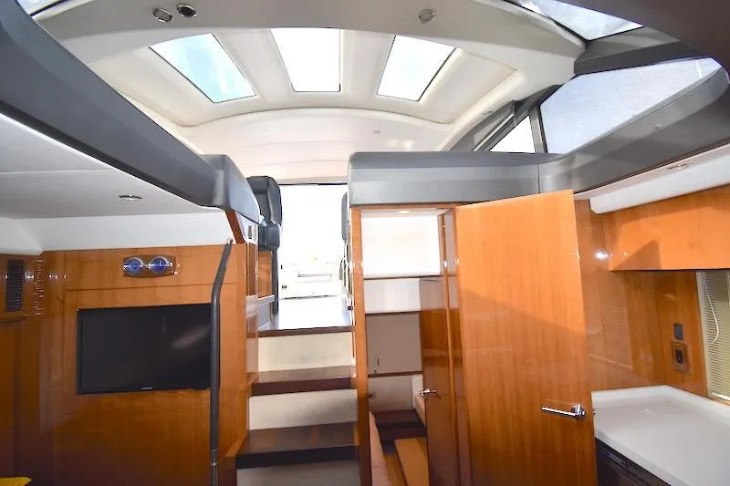 Slide: The Image of Interior of 2013 Princess V52 yacht with skylights, wooden cabinetry, and modern design. - 36