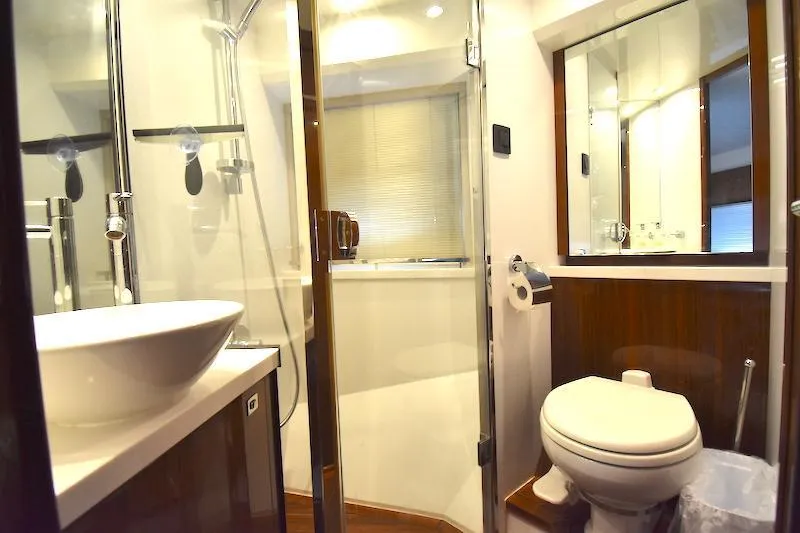 Slide: The Image of Luxurious bathroom in 2013 Princess V52 yacht with modern fixtures and glass shower. - 39