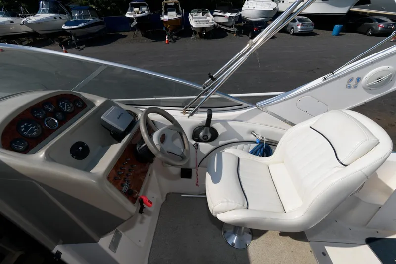 Slide: The Image of 1998 Bayliner 2855 Ciera boat cockpit with steering wheel and control panel. - 4