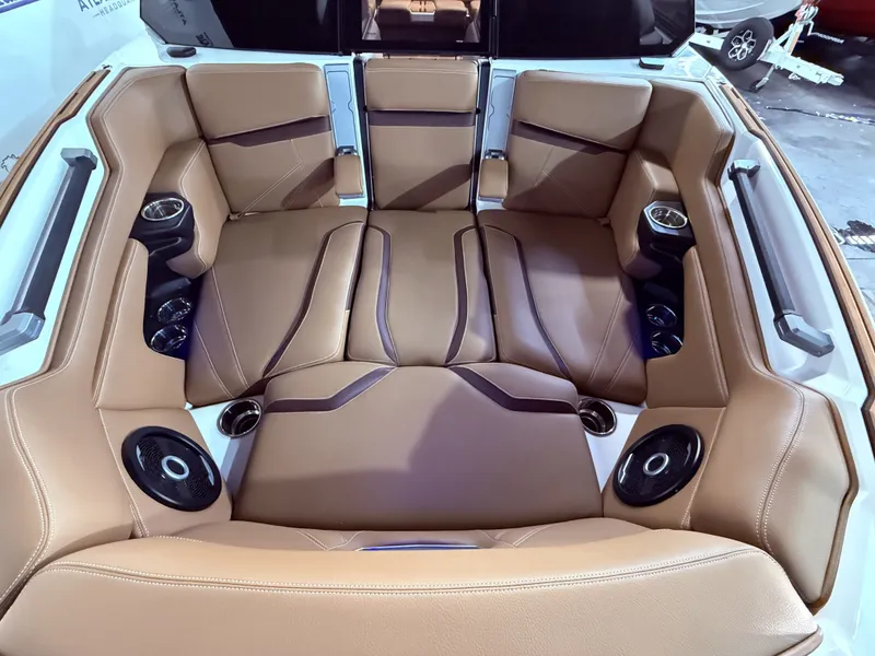 Slide: The Image of Interior of 2024 Supra SL 400 with brown leather seats. - 11