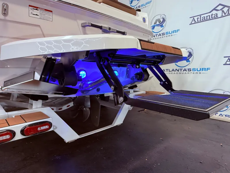 Slide: The Image of 2024 Supra SL 400 boat with blue underwater lighting. - 15