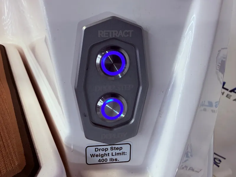 Slide: The Image of 2024 Supra SL 400 control buttons for drop step. - 17