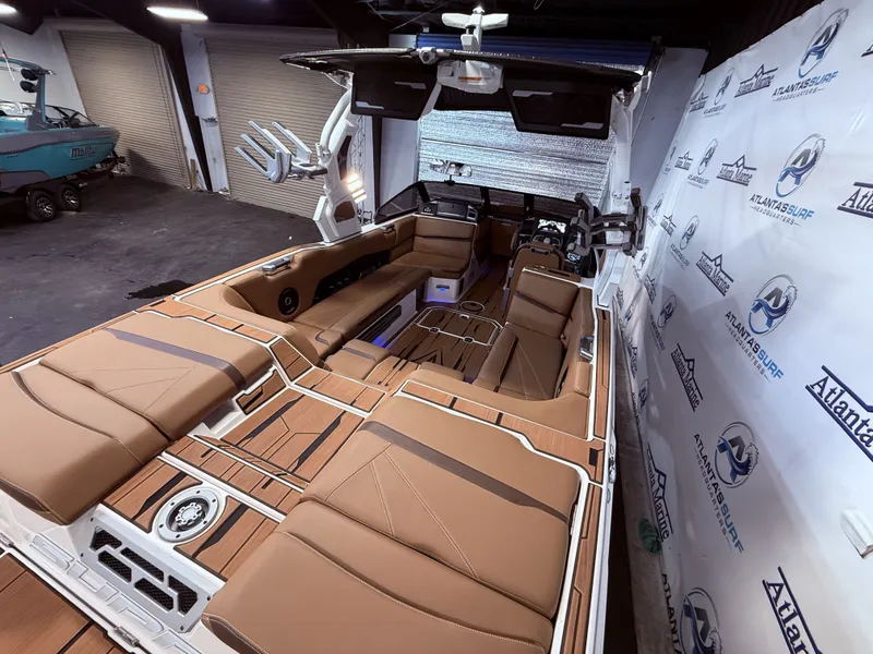 Slide: The Image of Interior of 2024 Supra SL 400 boat with luxurious seating. - 21