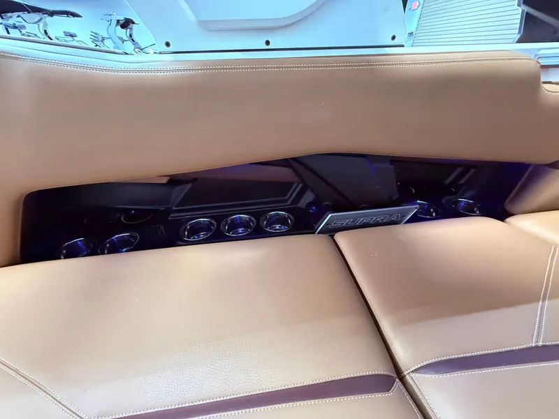 Slide: The Image of 2024 Supra SL 400 interior with brown leather seating. - 25