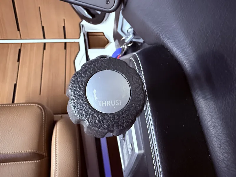 Slide: The Image of Interior of 2024 Supra SL 400 featuring thrust knob. - 27