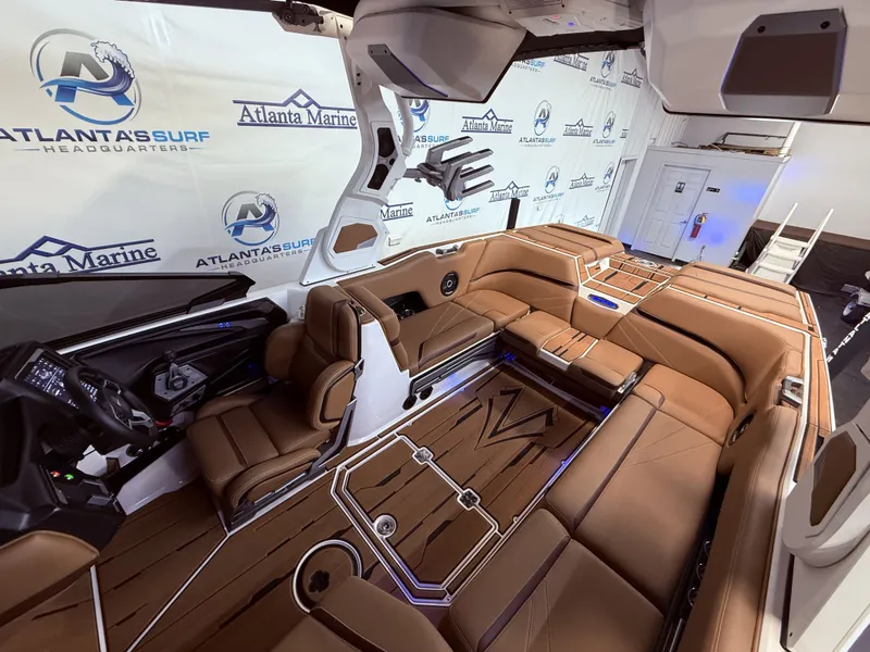 Slide: The Image of Interior of 2024 Supra SL 400 boat, luxurious brown seating. - 30