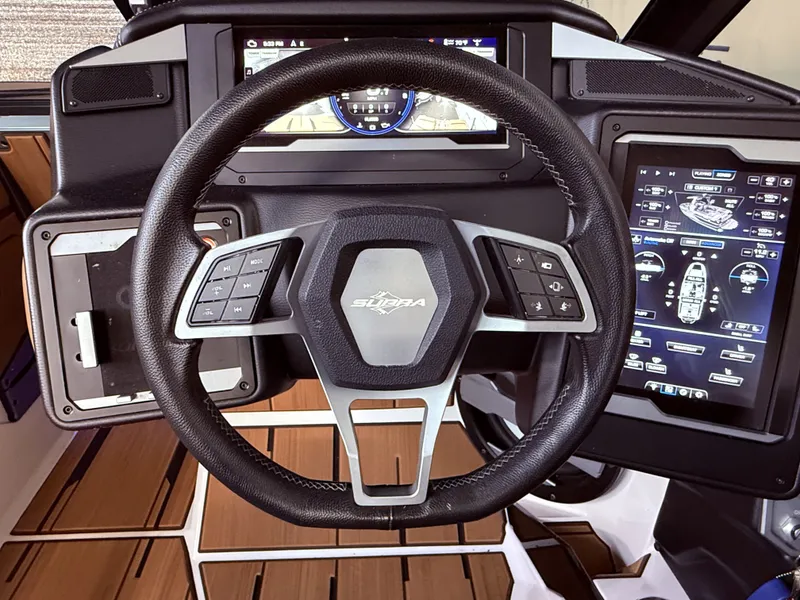 Slide: The Image of Steering wheel and dashboard of 2024 Supra SL 400 boat. - 35