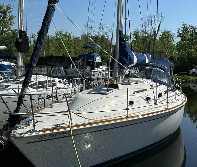 The Image of 1985 Pearson 36-2 sailboat docked in a marina. - 0