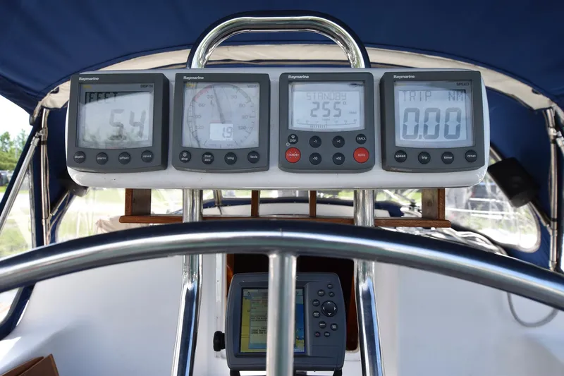 Slide: The Image of 1985 Pearson 36-2 sailboat cockpit with navigation instruments and GPS. - 11