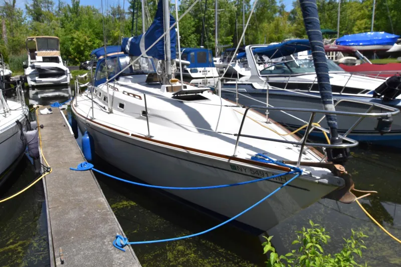 Slide: The Image of 1985 Pearson 36-2 sailboat docked at a marina. - 2