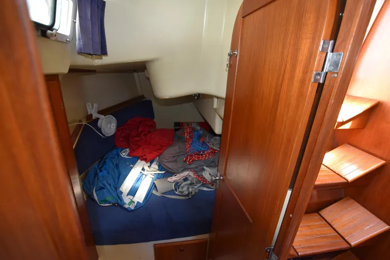 Slide: The Image of 1985 Pearson 36-2 sailboat interior cabin with wooden door and steps - 24